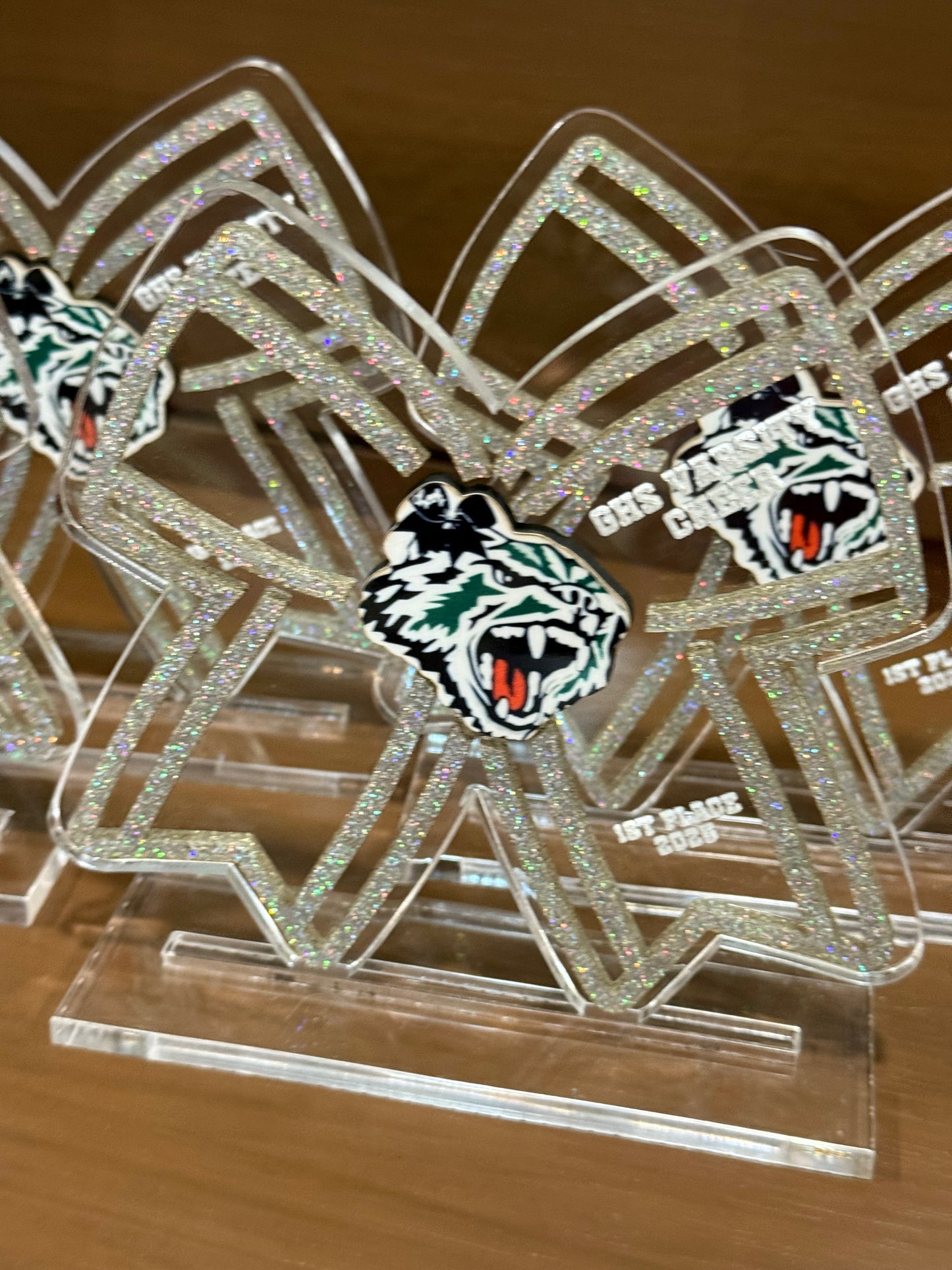 Custom bow-shaped cheerleader trophy with photo
